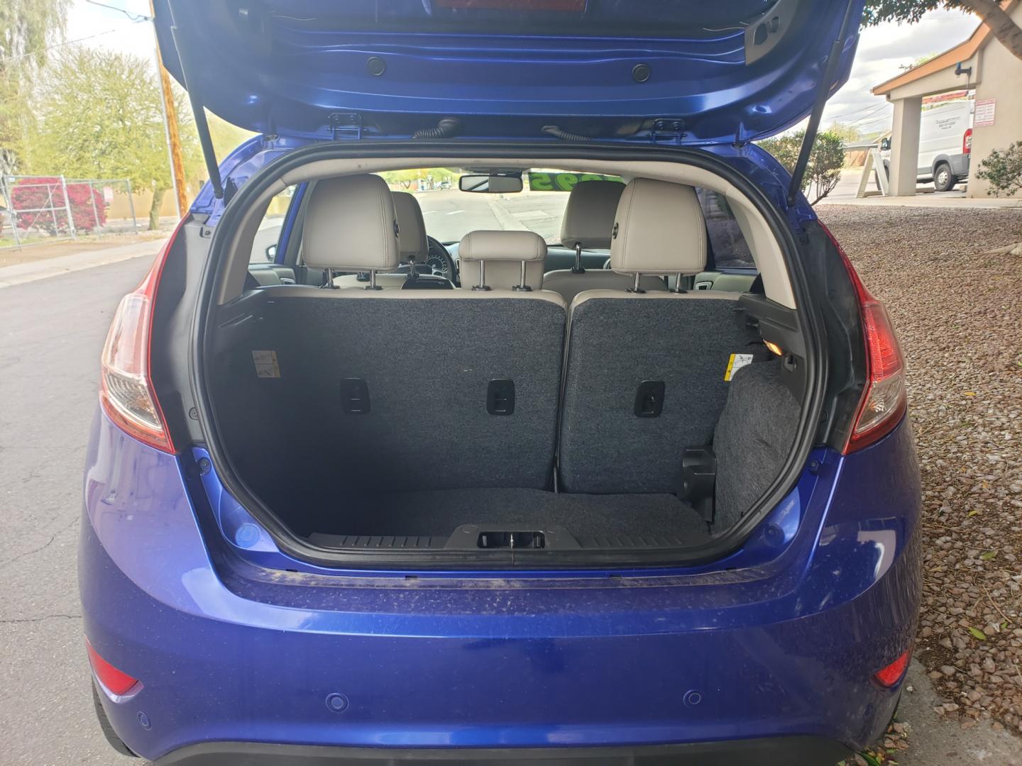 2014 /Tan and black Ford Fiesta Titanium (3FADP4FJ5EM) with an 1.6l i4 engine, 6-Speed Automatic transmission, located at 323 E Dunlap Ave., Phoenix, AZ, 85020, (602) 331-9000, 33.567677, -112.069000 - 2014 Ford Fiesta Titanium,.......A Must See!!... No accidents, Only 95K MILES.... Ice cold AC. The car is gorgeous inside and out. Power windows, Power door locks, Touch screen Stereo/ CD Player, Phone sync, Bluetooth, Satellite compatible, Backup camera, Beautiful tan and black interior with tan le - Photo#16
